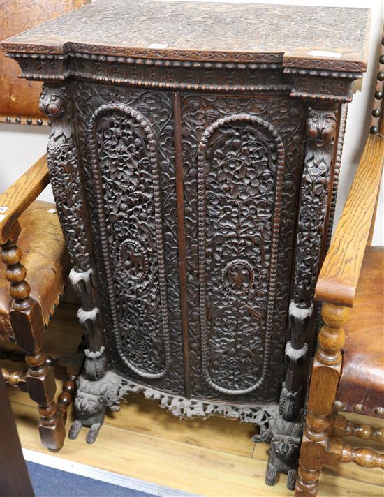 An Antique heavily carved cupboard W.66cm